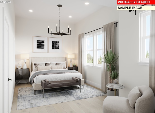bedroom with an inviting chandelier, recessed lighting, baseboards, and wood finished floors