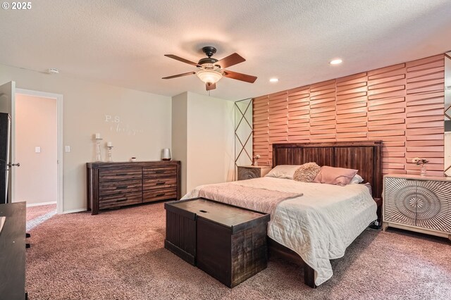 bedroom featuring recessed lighting, a textured ceiling, a ceiling fan, and carpet floors