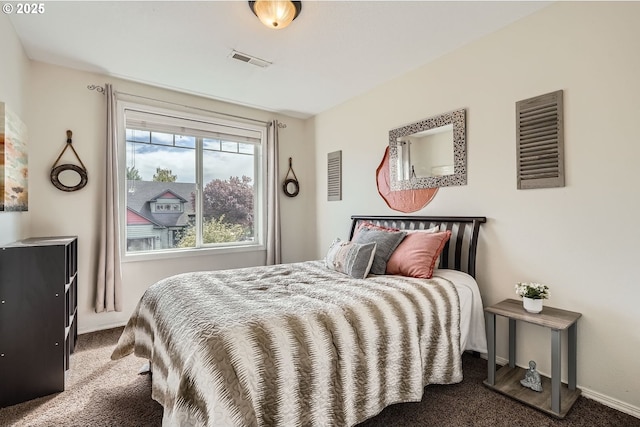 bedroom featuring visible vents, baseboards, and carpet floors