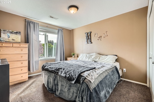carpeted bedroom featuring visible vents and baseboards