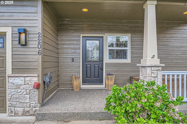 view of exterior entry with stone siding
