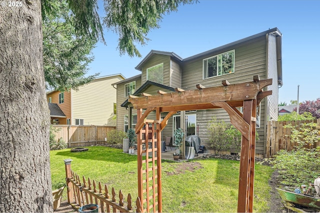 rear view of house featuring a patio, a fenced backyard, a pergola, and a lawn