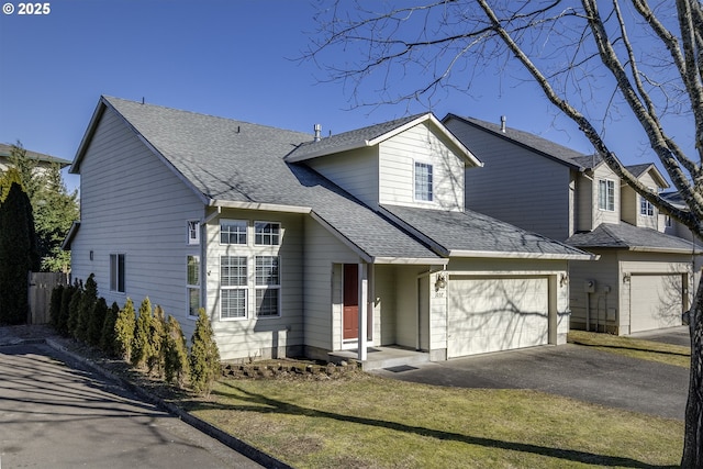 view of front facade with a garage and a front yard