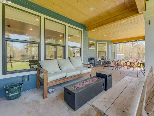 view of patio featuring an outdoor living space with a fire pit and outdoor dining space