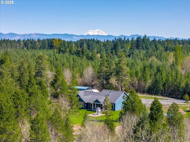 bird's eye view featuring a mountain view and a wooded view