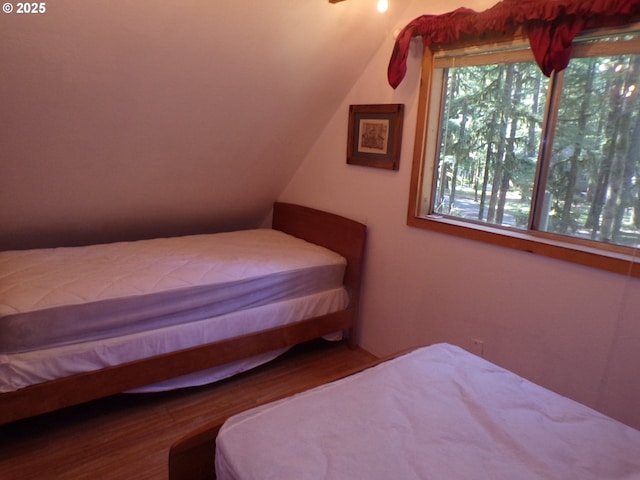 bedroom with wood finished floors