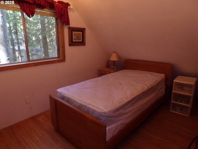 bedroom featuring wood finished floors