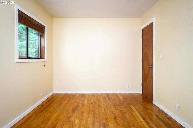 empty room featuring wood-type flooring