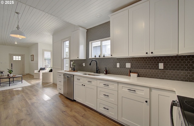 126 NE Garfield St, Camas, WA 98607 - kitchen featuring dishwasher, stove, white cabinetry, wood ceiling, and backsplash