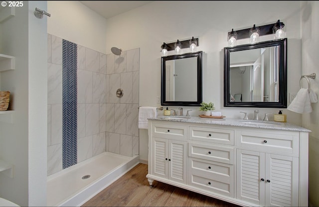 126 NE Garfield St, Camas, WA 98607 - bathroom featuring double vanity, wood finished floors, and tiled shower