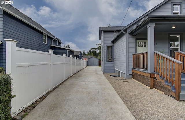 126 NE Garfield St, Camas, WA 98607 - view of side of property with a storage shed and a porch