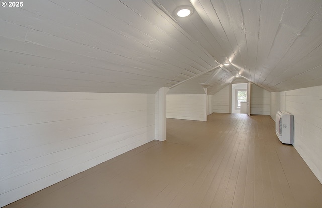 126 NE Garfield St, Camas, WA 98607 - bonus room with vaulted ceiling, wooden ceiling, hardwood / wood-style flooring, wood walls, and heating unit