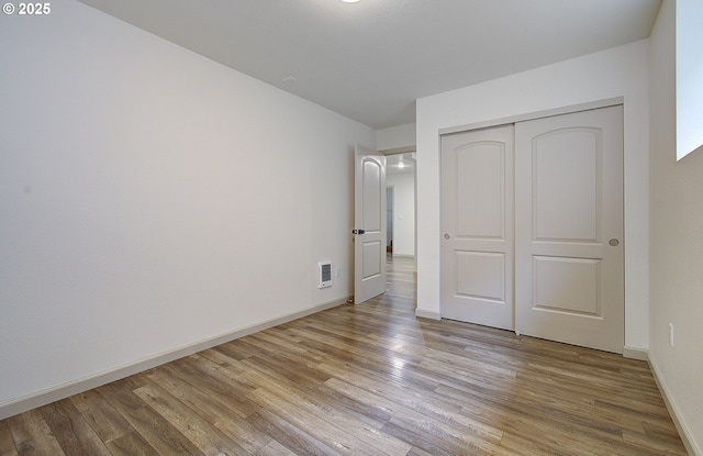 126 NE Garfield St, Camas, WA 98607 - unfurnished bedroom with light wood finished floors and a closet