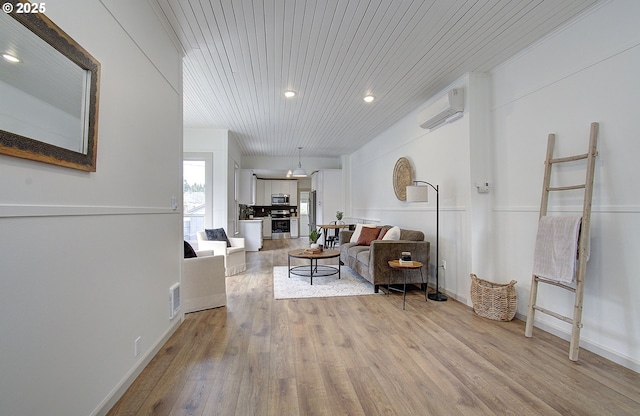 126 NE Garfield St, Camas, WA 98607 - living room featuring light wood-style floors, a wall mounted AC, recessed lighting, and wooden ceiling