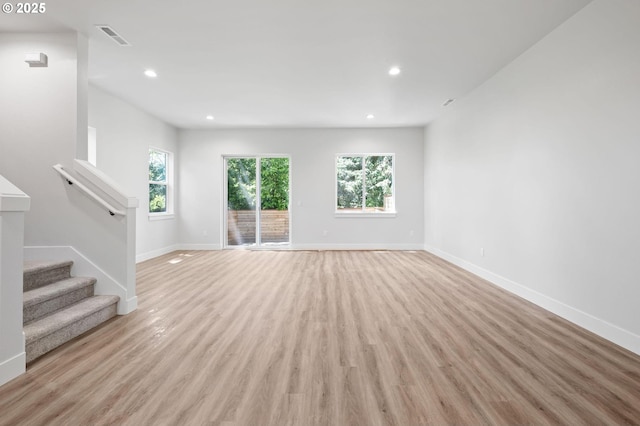 9258 SW Waverly Dr, Tigard, OR 97224 - unfurnished living room with baseboards, light wood finished floors, recessed lighting, and stairs