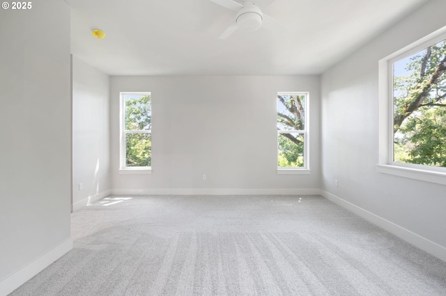 9258 SW Waverly Dr, Tigard, OR 97224 - carpeted spare room featuring plenty of natural light, a ceiling fan, and baseboards