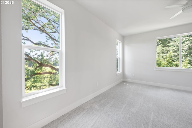 9258 SW Waverly Dr, Tigard, OR 97224 - empty room featuring plenty of natural light, baseboards, carpet floors, and a ceiling fan