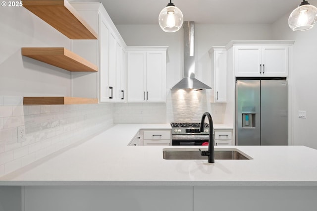9258 SW Waverly Dr, Tigard, OR 97224 - kitchen featuring appliances with stainless steel finishes, wall chimney exhaust hood, a sink, open shelves, and light countertops