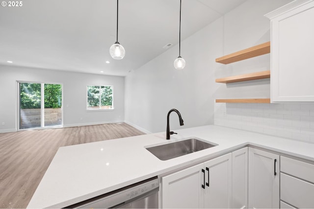 9258 SW Waverly Dr, Tigard, OR 97224 - kitchen featuring a sink, open floor plan, light wood-style floors, dishwasher, and backsplash