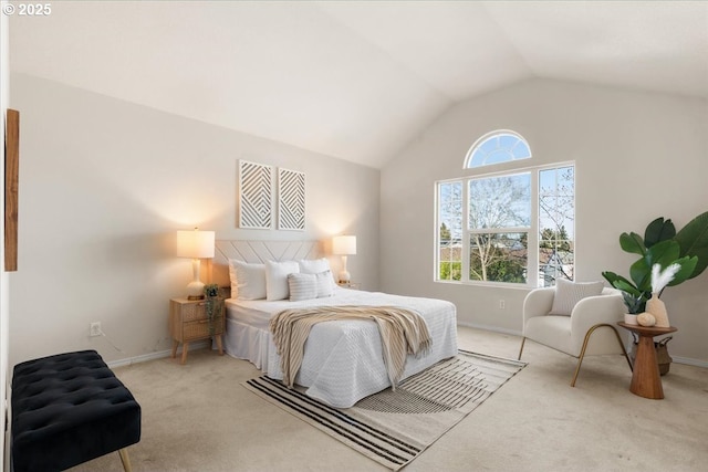 bedroom with vaulted ceiling, carpet floors, and baseboards