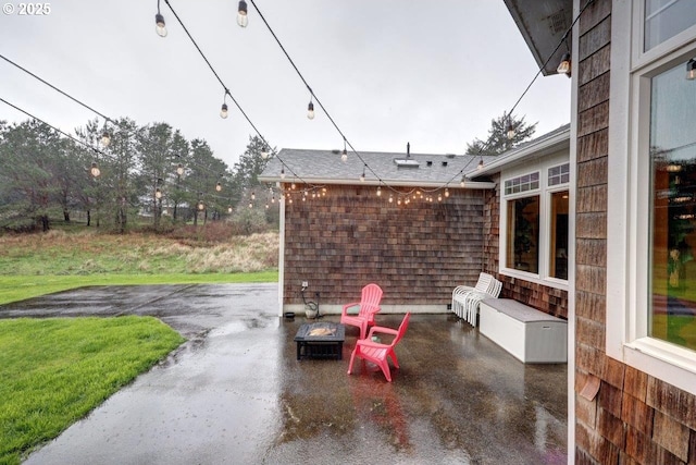 view of patio / terrace with a fire pit