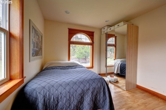 bedroom with light hardwood / wood-style floors