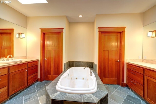 bathroom with a relaxing tiled tub and vanity