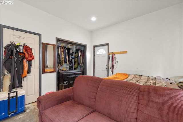 interior space with unfinished concrete flooring and recessed lighting