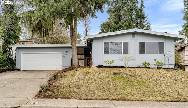 view of front of home featuring driveway, crawl space, and a garage