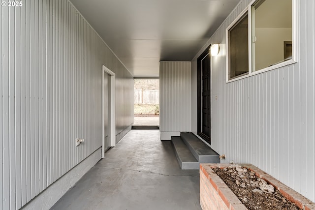 hallway with concrete floors