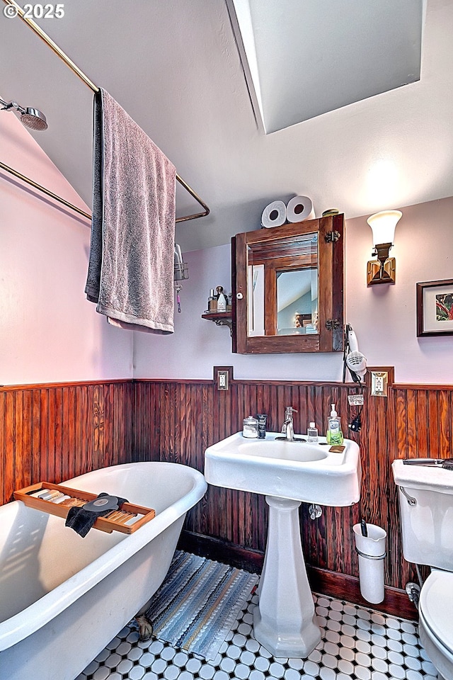 3820 N Haight Ave, Portland, OR 97227 - bathroom featuring a wainscoted wall, a freestanding bath, toilet, and wood walls