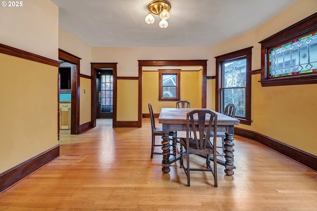 3820 N Haight Ave, Portland, OR 97227 - dining room with light wood-style floors, baseboards, and healthy amount of natural light