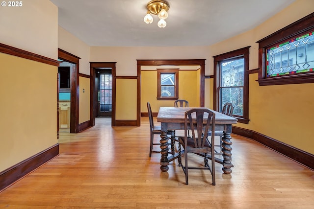 dining area featuring light wood-type flooring