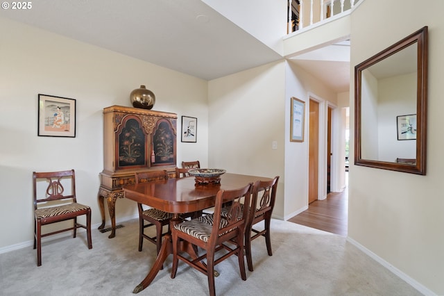 11442 SW Woodlee Heights Ct, Portland, OR 97219 - dining room featuring light carpet and baseboards
