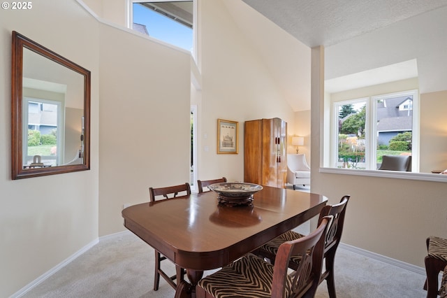 11442 SW Woodlee Heights Ct, Portland, OR 97219 - dining space featuring light colored carpet and high vaulted ceiling