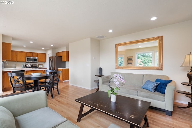 11442 SW Woodlee Heights Ct, Portland, OR 97219 - living room with light wood-style flooring and recessed lighting