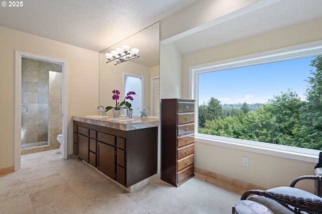 11442 SW Woodlee Heights Ct, Portland, OR 97219 - full bathroom with double vanity, a chandelier, and a shower stall