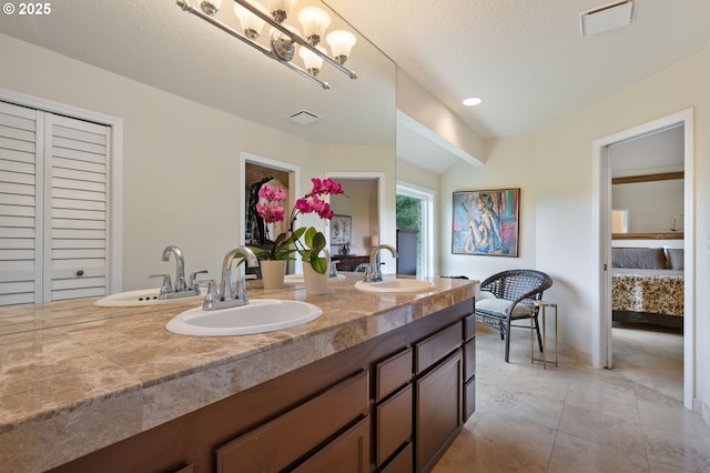 11442 SW Woodlee Heights Ct, Portland, OR 97219 - full bathroom featuring a closet, double vanity, tile patterned floors, ensuite bath, and a chandelier