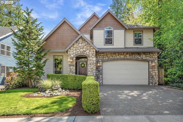 7102 SW 78th Ave, Portland, OR 97223 - craftsman-style home with stone siding, concrete driveway, a garage, and a front yard