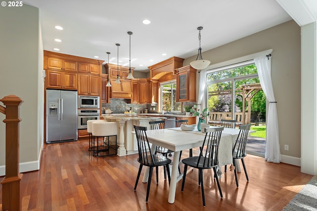 7102 SW 78th Ave, Portland, OR 97223 - dining area with recessed lighting, wood finished floors, and baseboards