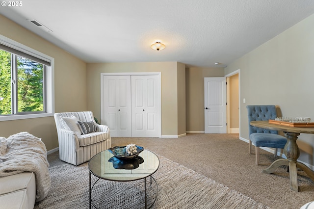7102 SW 78th Ave, Portland, OR 97223 - carpeted living area with baseboards and a textured ceiling