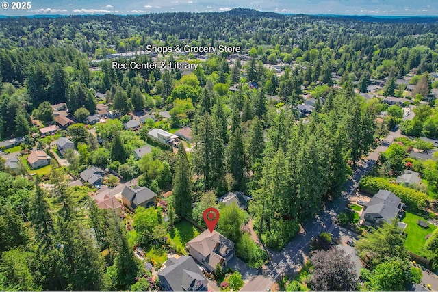 7102 SW 78th Ave, Portland, OR 97223 - aerial view of property and surrounding area featuring a heavily wooded area and nearby suburban area