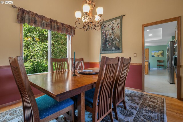 3003 NE 164th St, Ridgefield, WA 98642 - dining area with wood finished floors and a chandelier