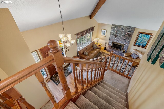 3003 NE 164th St, Ridgefield, WA 98642 - stairs with a chandelier, a fireplace, and wood finished floors