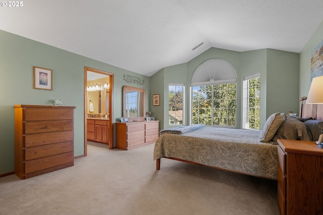 3003 NE 164th St, Ridgefield, WA 98642 - bedroom with light colored carpet, vaulted ceiling, and ensuite bathroom