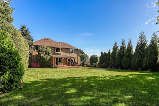 3003 NE 164th St, Ridgefield, WA 98642 - view of green lawn with a wooden deck