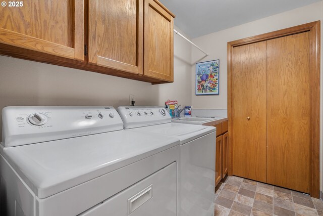 3003 NE 164th St, Ridgefield, WA 98642 - laundry area with washer and dryer, cabinet space, and stone finish flooring