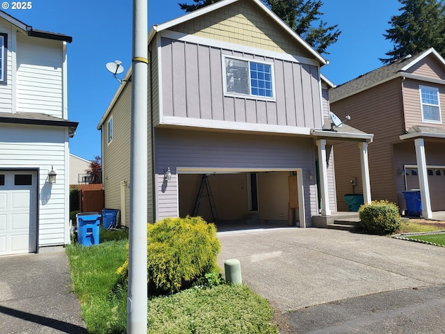 5906 NE 56th St, Vancouver, WA 98661 - view of front of property with board and batten siding, driveway, and a garage