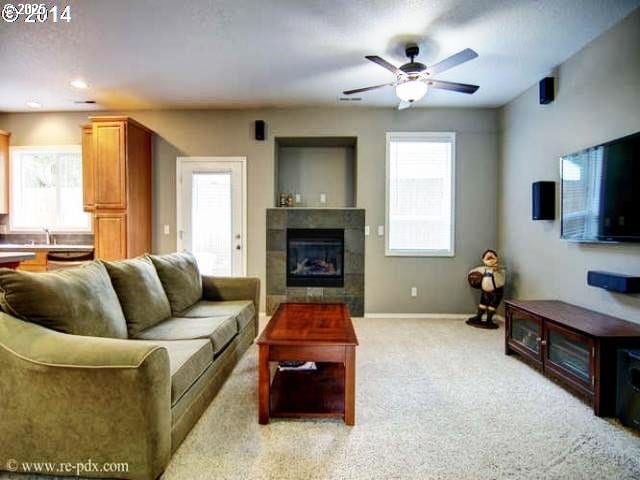 5906 NE 56th St, Vancouver, WA 98661 - living area featuring ceiling fan, a tile fireplace, light colored carpet, and recessed lighting