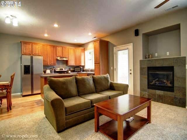 5906 NE 56th St, Vancouver, WA 98661 - living room featuring light colored carpet, a fireplace, and recessed lighting